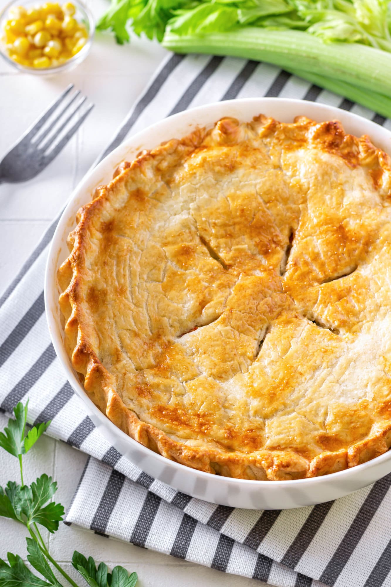 chicken-pot-pie-in-baking-dish-on-striped-towel