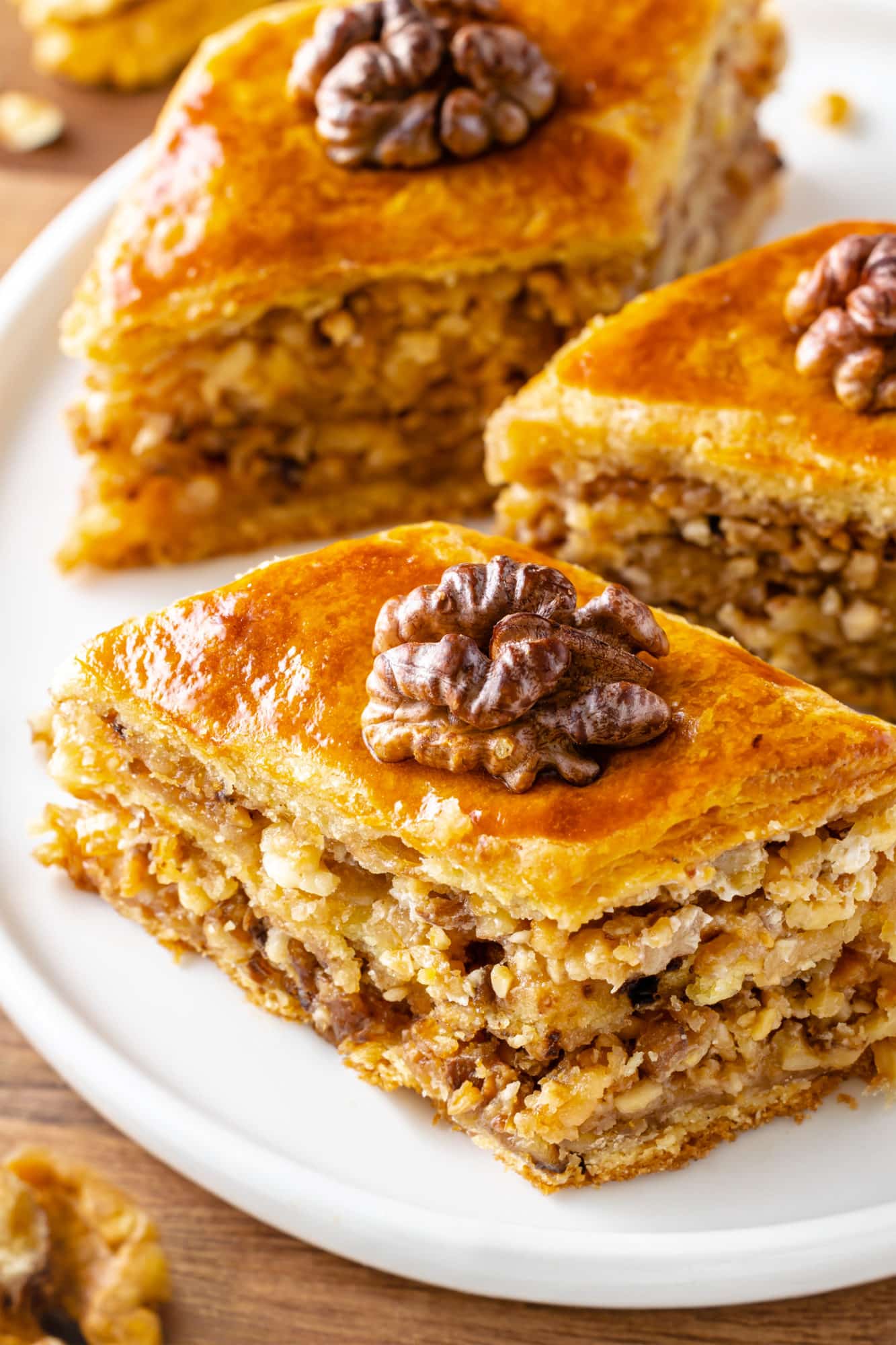 baklava-pieces-on-a-white-plate-with-a-walnut-on-top