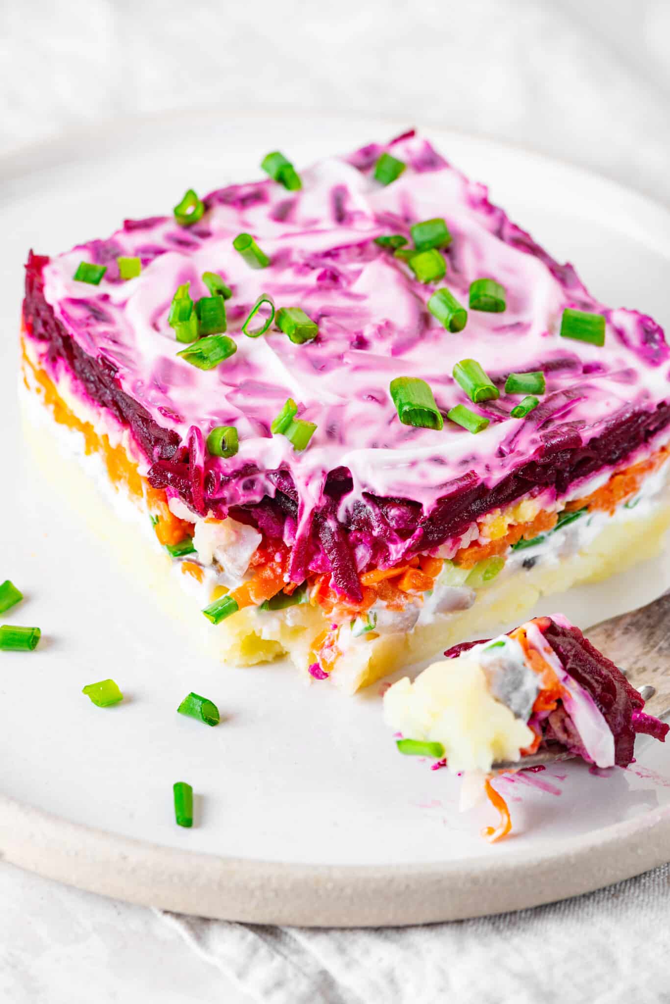 herring-salad-piece-on-a-white-plate