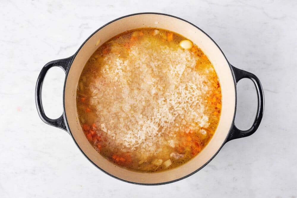 Rice pilaf cooking in a pot.