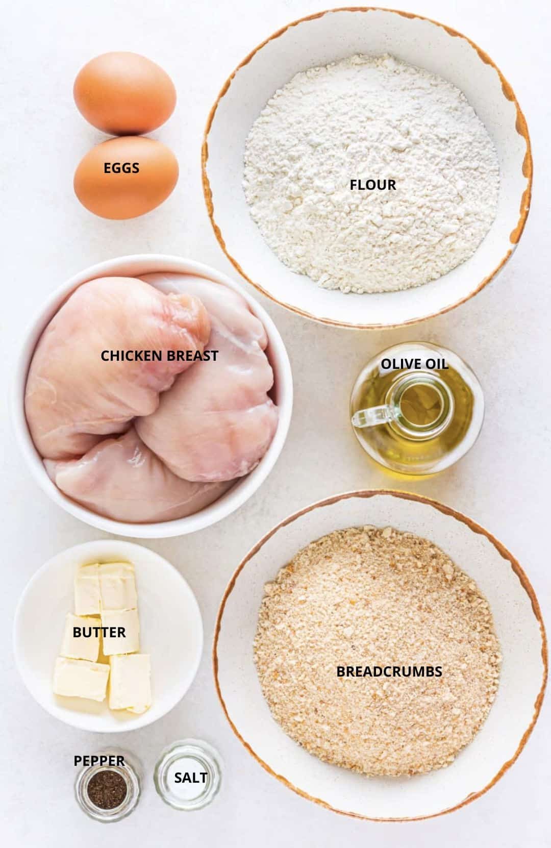 Stuffed chicken breast ingredients flour, eggs, chicken breast, olive oil, breadcrumbs, butter, pepper, and salt.