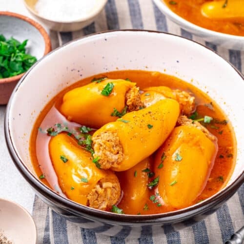 A bowl of stuffed peppers with chicken.