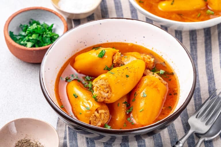 A bowl of stuffed peppers with chicken.