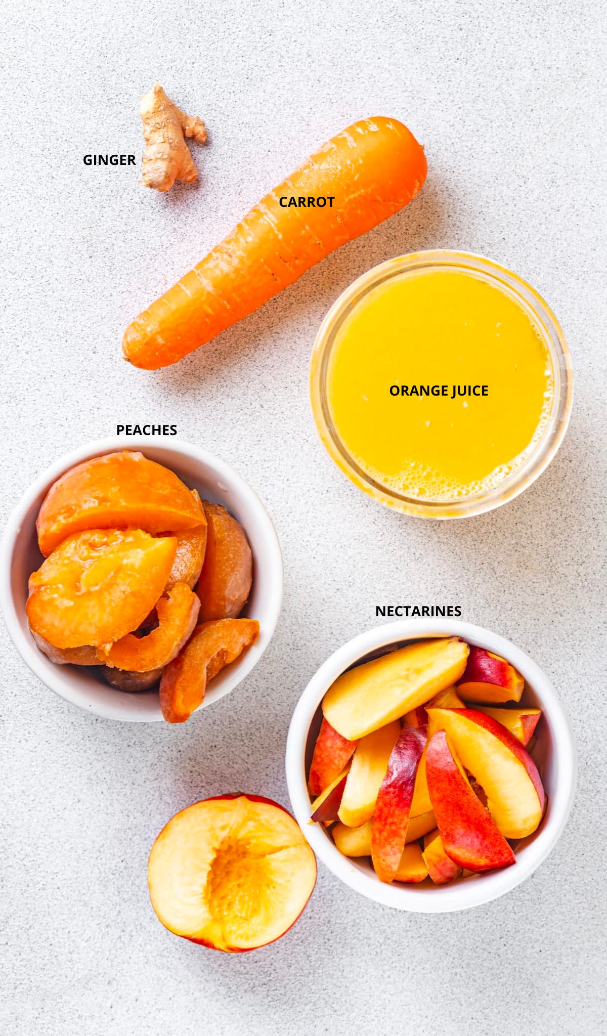 apricot smoothie ingredients with labels garlic carrot orange juice peaches and nectarines.