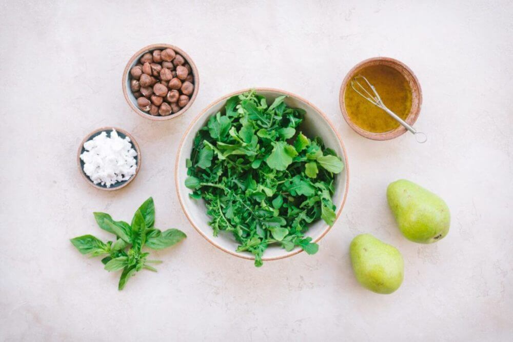 ingredients-for-arugula-salad-arugula-pears-dressing-hazelnuts-goat-cheese-basil