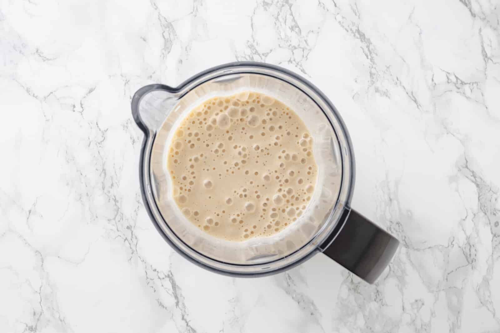 Blended smoothie in a pitcher.