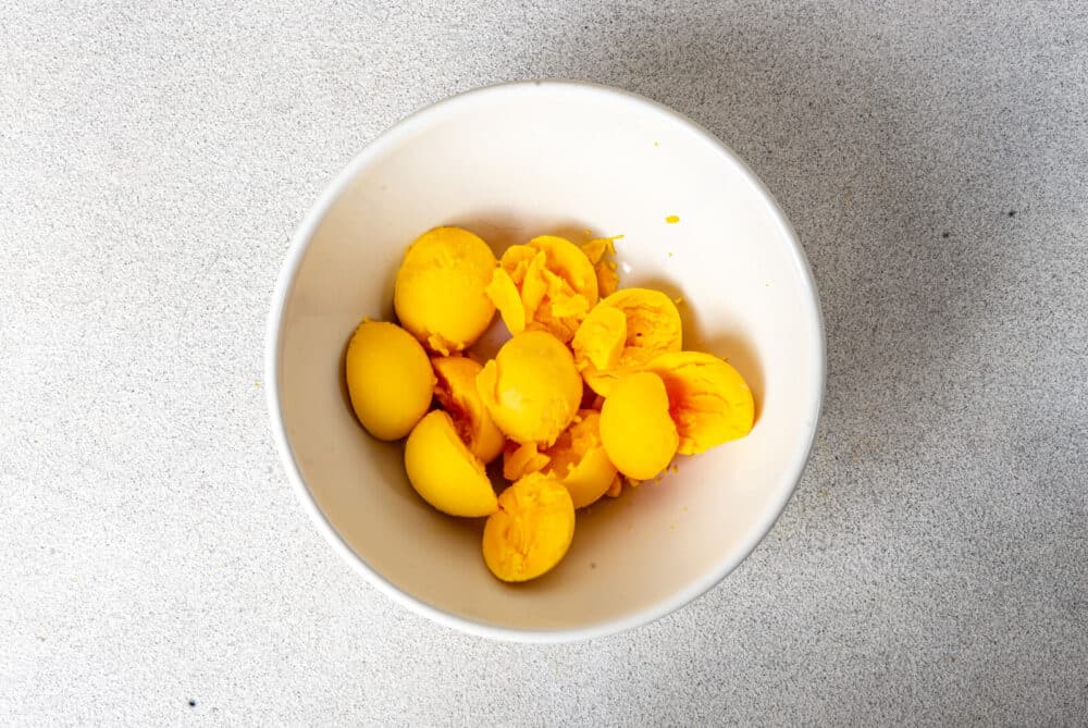 Boiled egg yolks in a bowl.