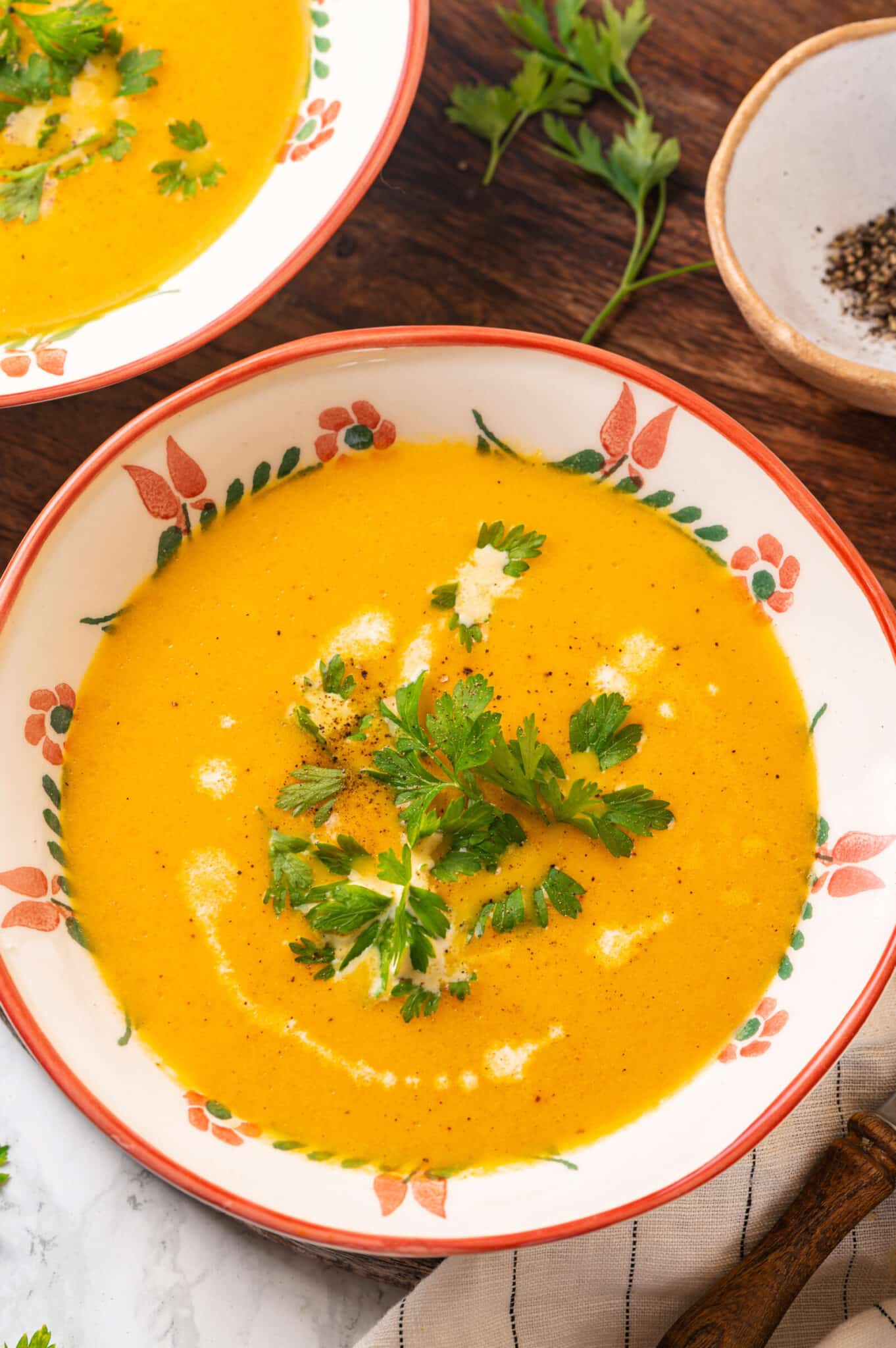 blended carrot and ginger soup in a bowl.