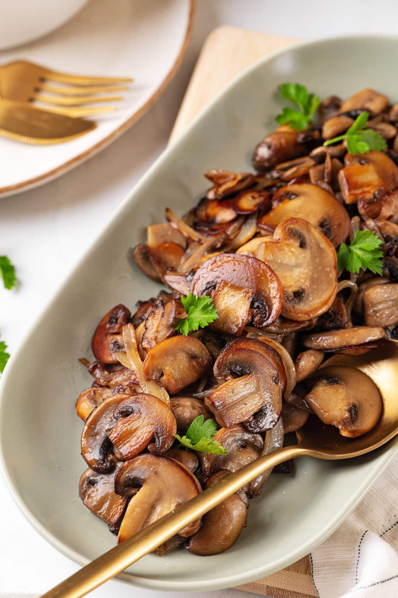 Close up of sautéed mushrooms in a dish.