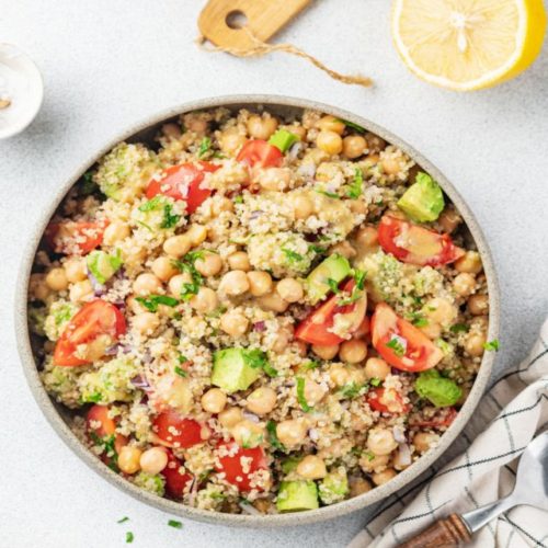 quinoa-chickpea-salad-in-grey-bowl-spoon-with-towel