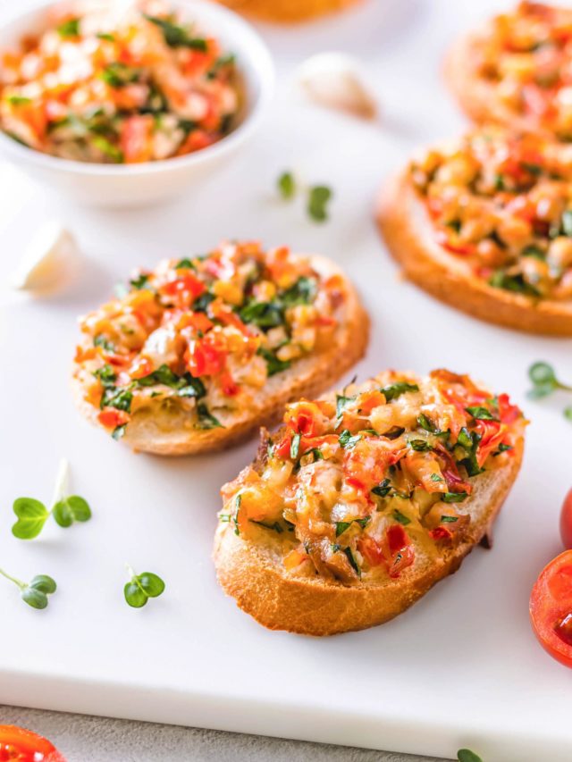 Bruschetta on a white counter top.