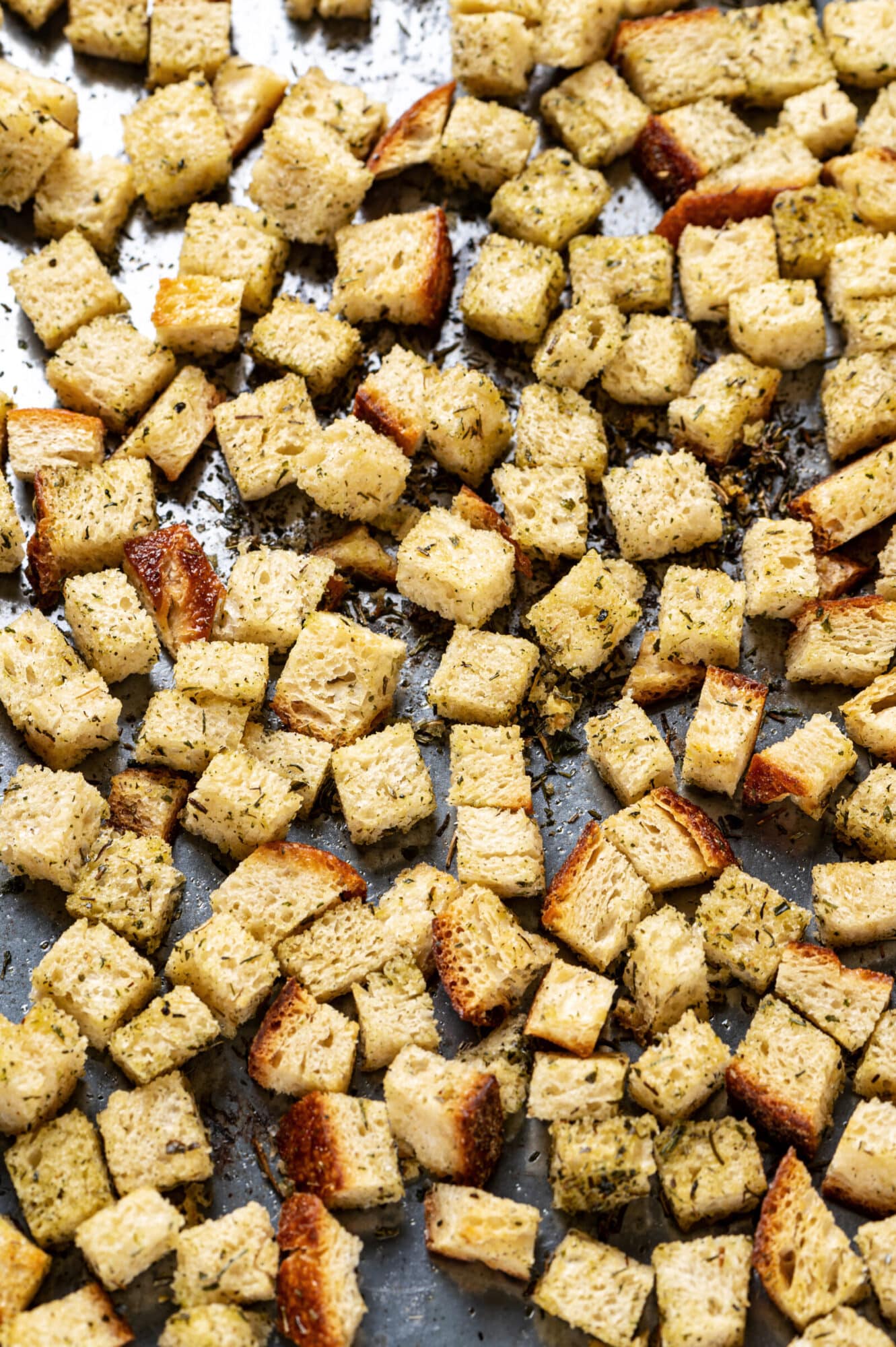 Close up of croutons on a baking tray.