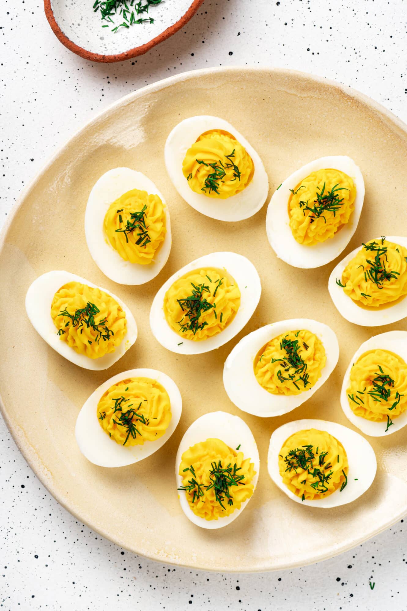 deviled eggs on a plate 1331x2000