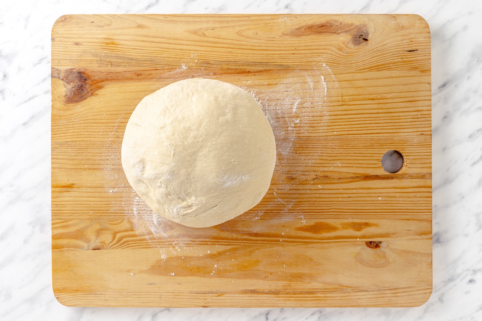 Dough on a floured surface.