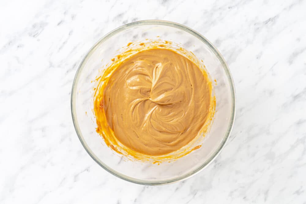 Dulce de leche prepared in a glass bowl.