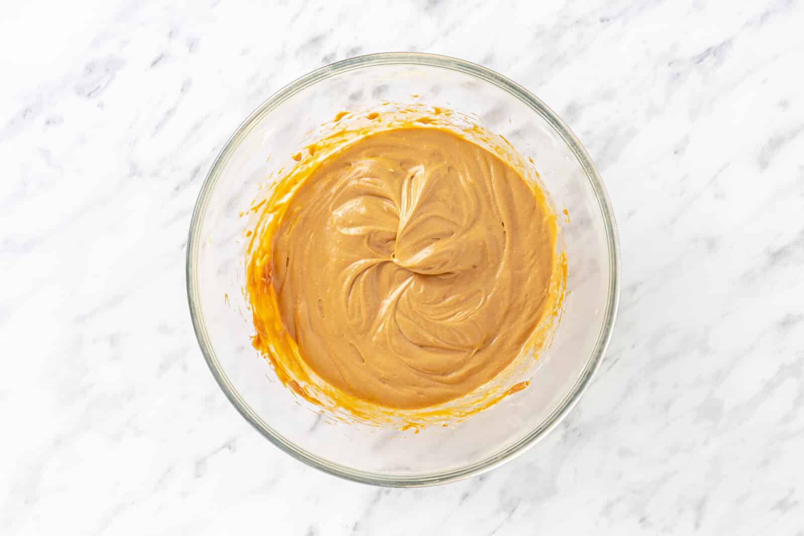 Dulce de leche prepared in a glass bowl.