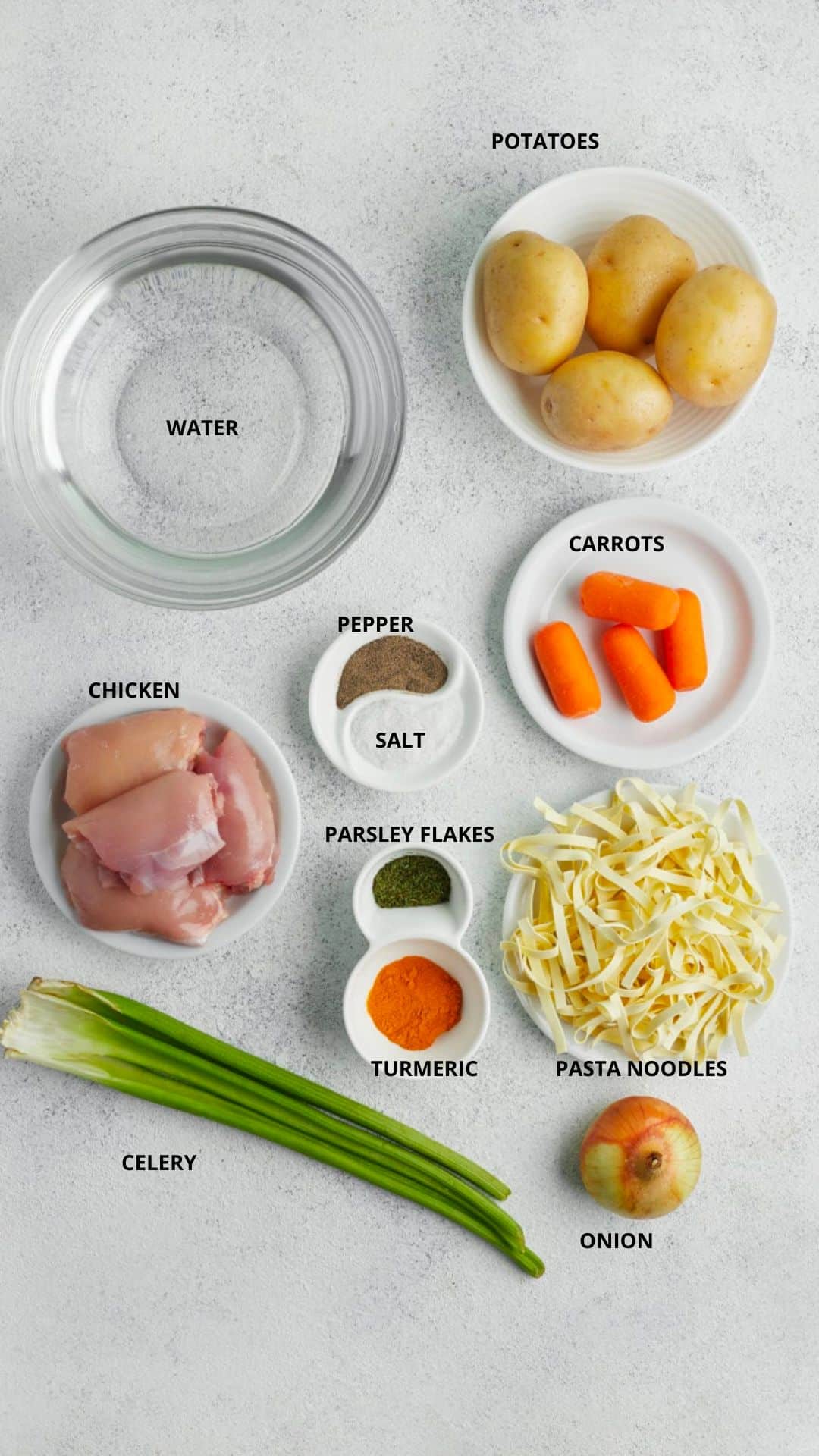 classic chicken noodle soup ingredients- potatoes, water, carrots, pepper, salt, parsley flakes, turmeric, chicken, pasta noodles, onion, and celery.