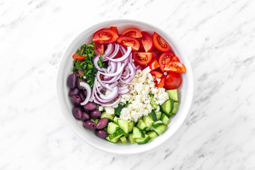 Greek salad chopped ingredients in a bowl.