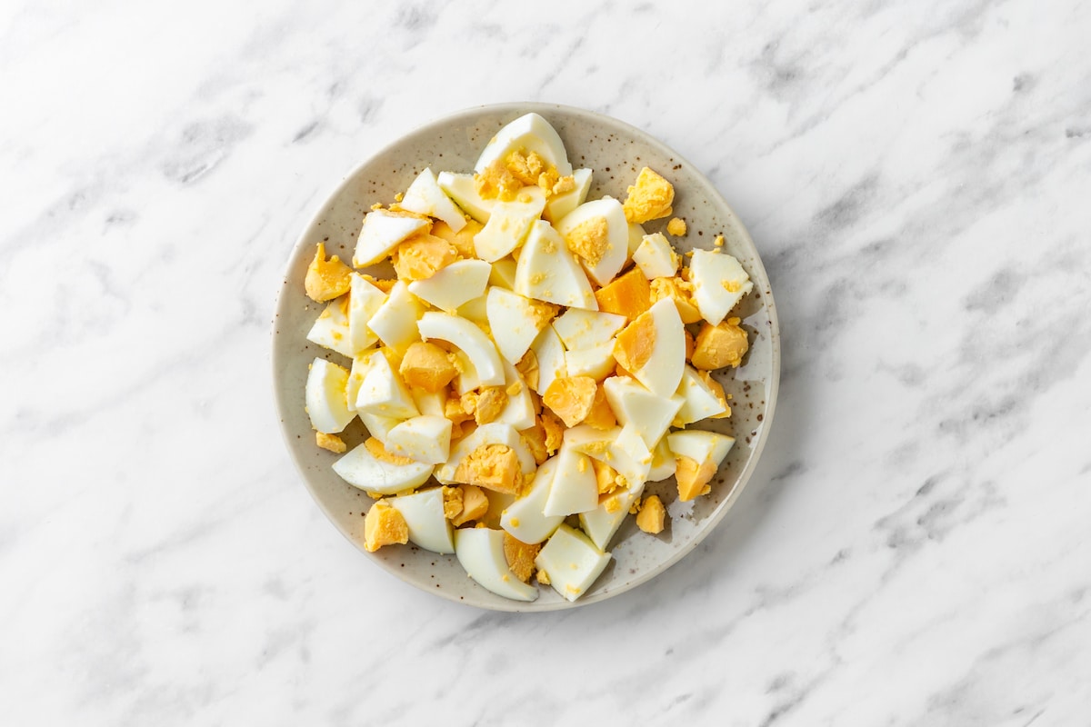 chopped boiled eggs on a grey plate. 