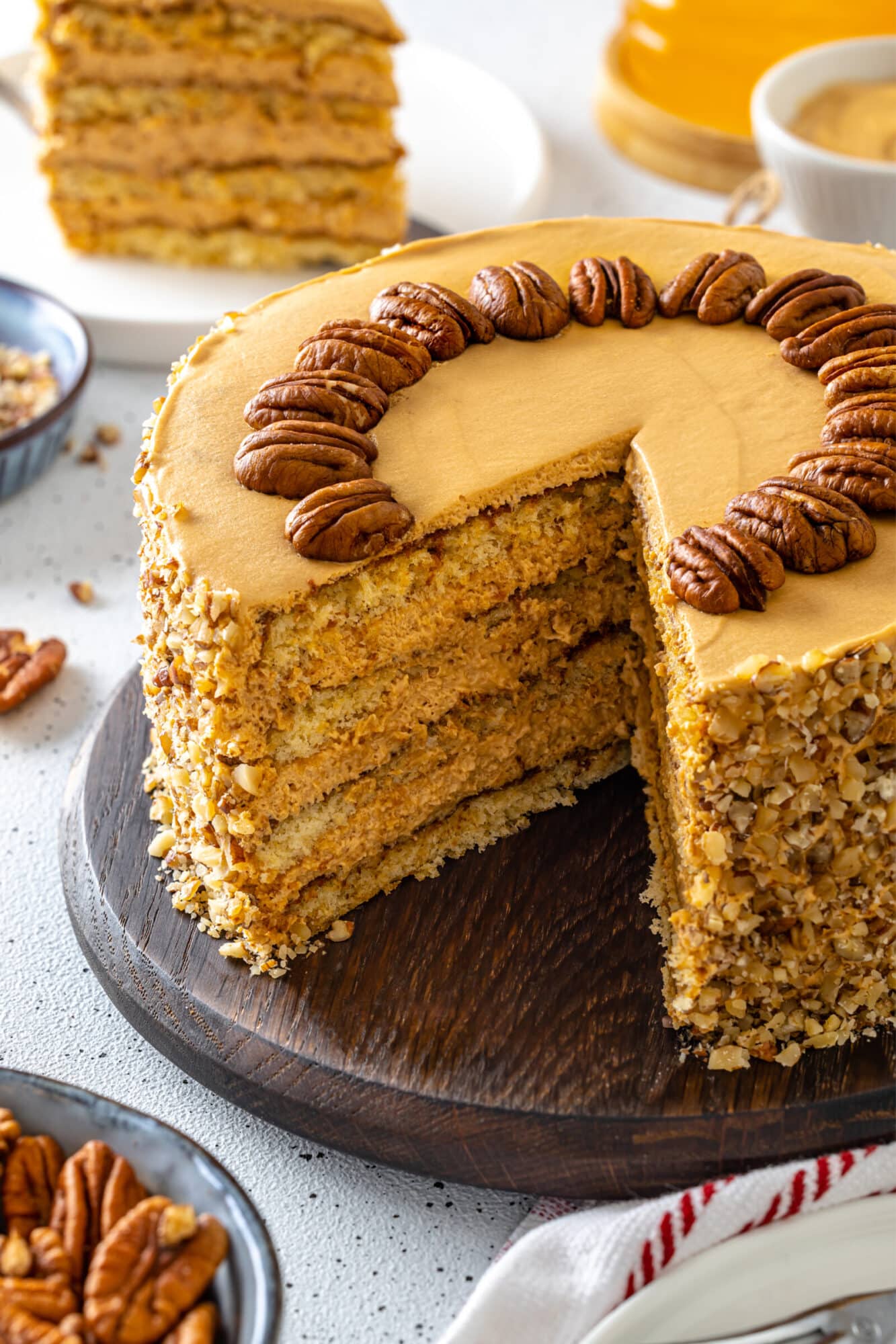 Honey pecan cake with pecans decorating the top.