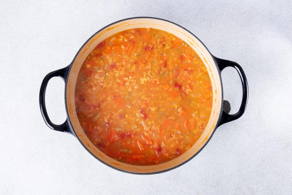 Red lentil soup cooking.