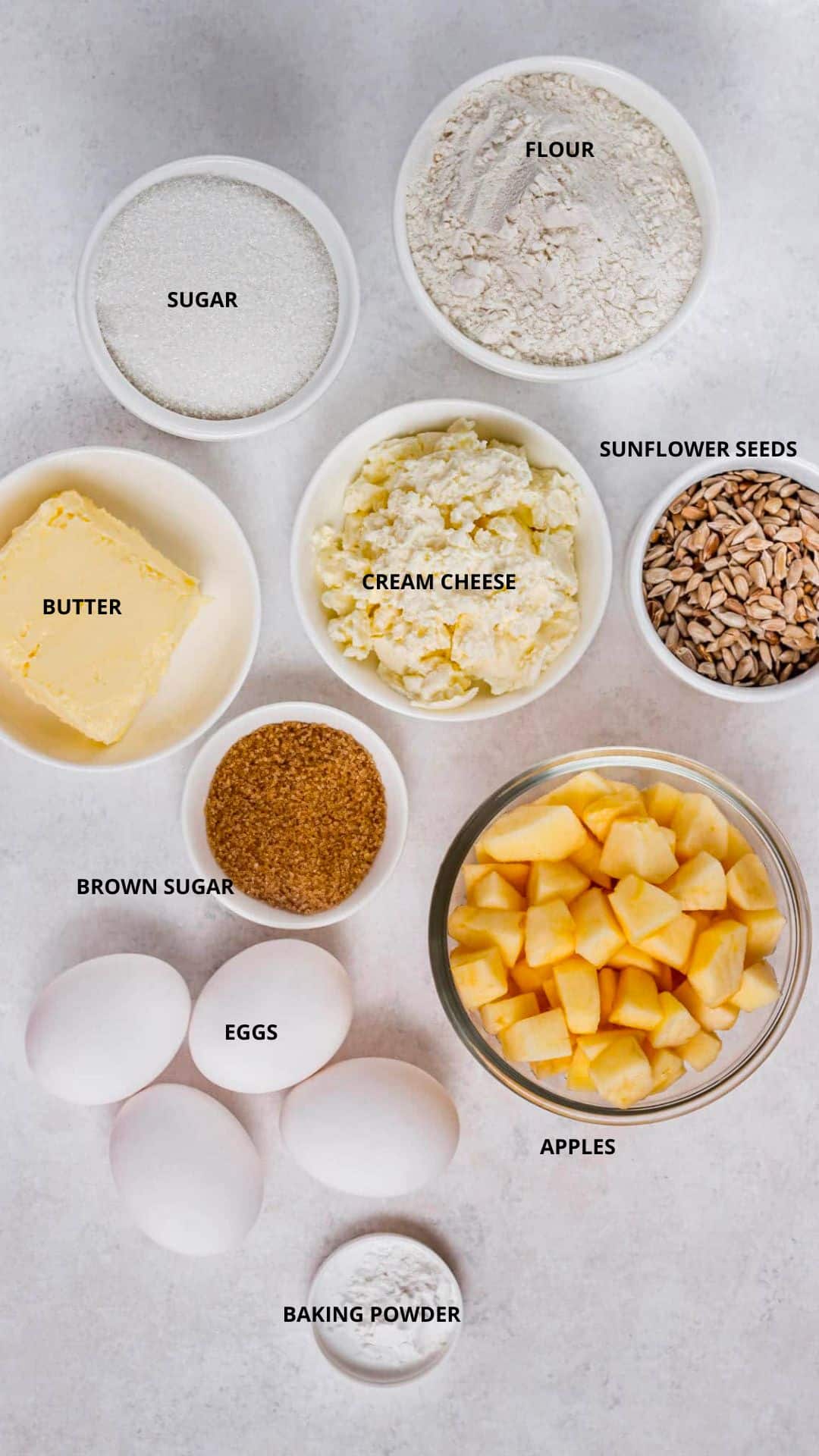 Ingredients spread- flour, sugar, butter, cream cheese, sunflower seeds, brown sugar, eggs, apples, and baking powder.