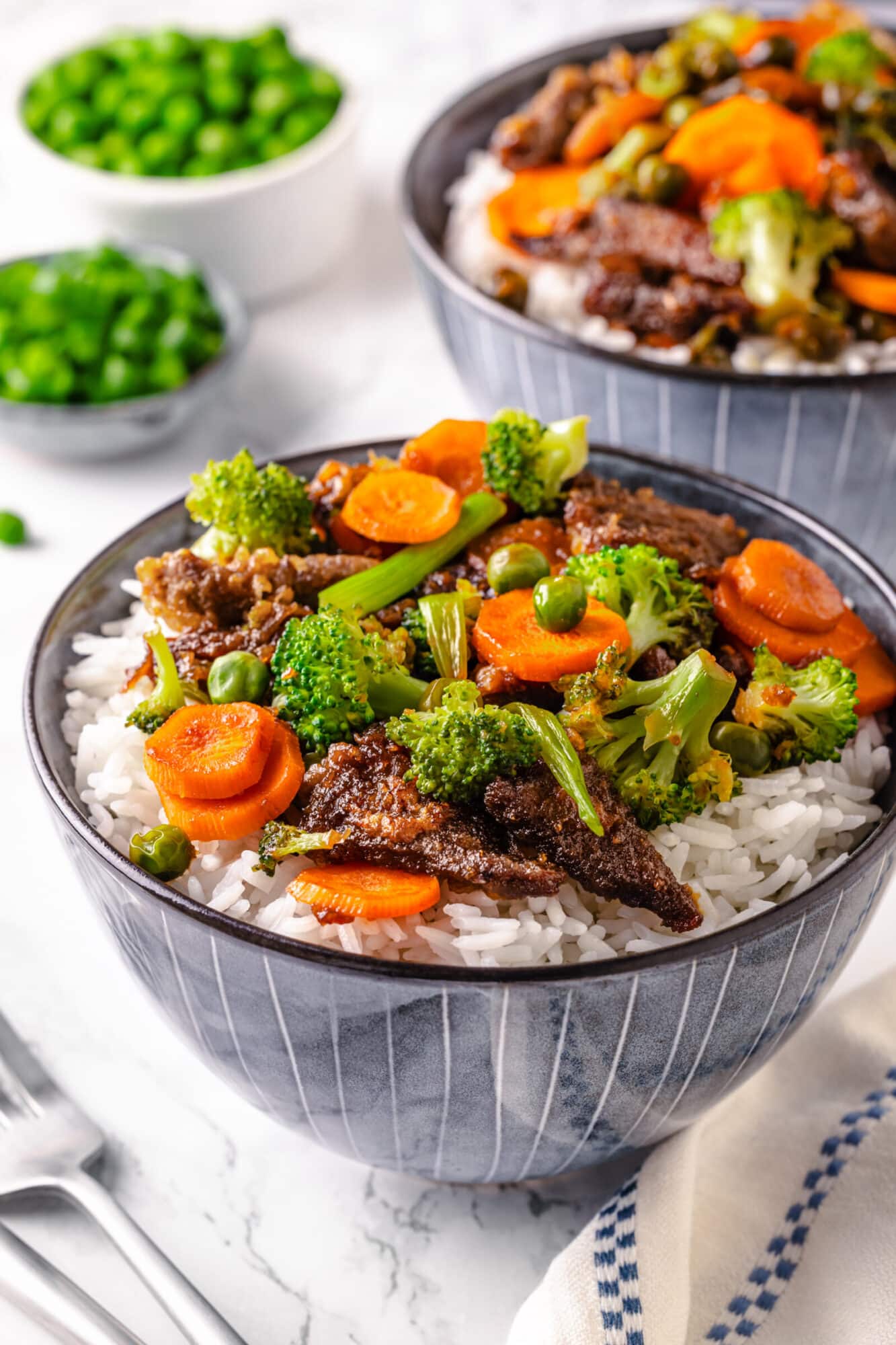 Mongolian beef with mixed vegetables over white rice. 