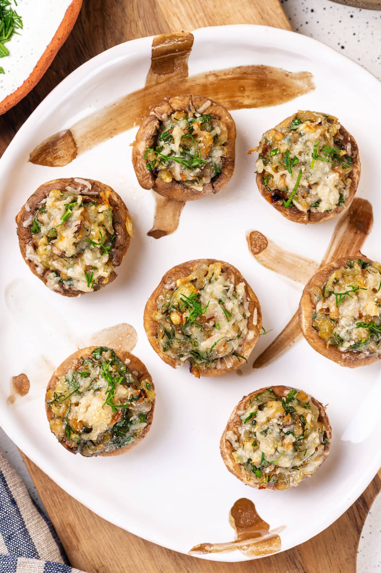 Stuffed mushrooms on a white plate.