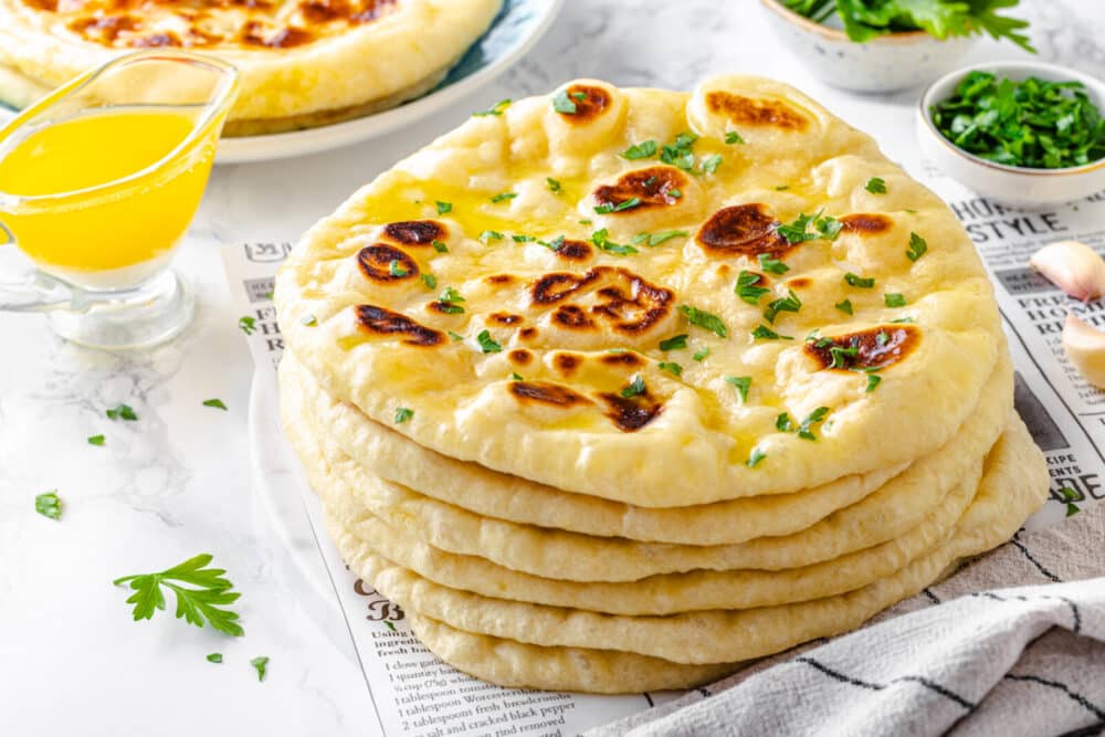 Naan Bread with parsely and butter 1000x667