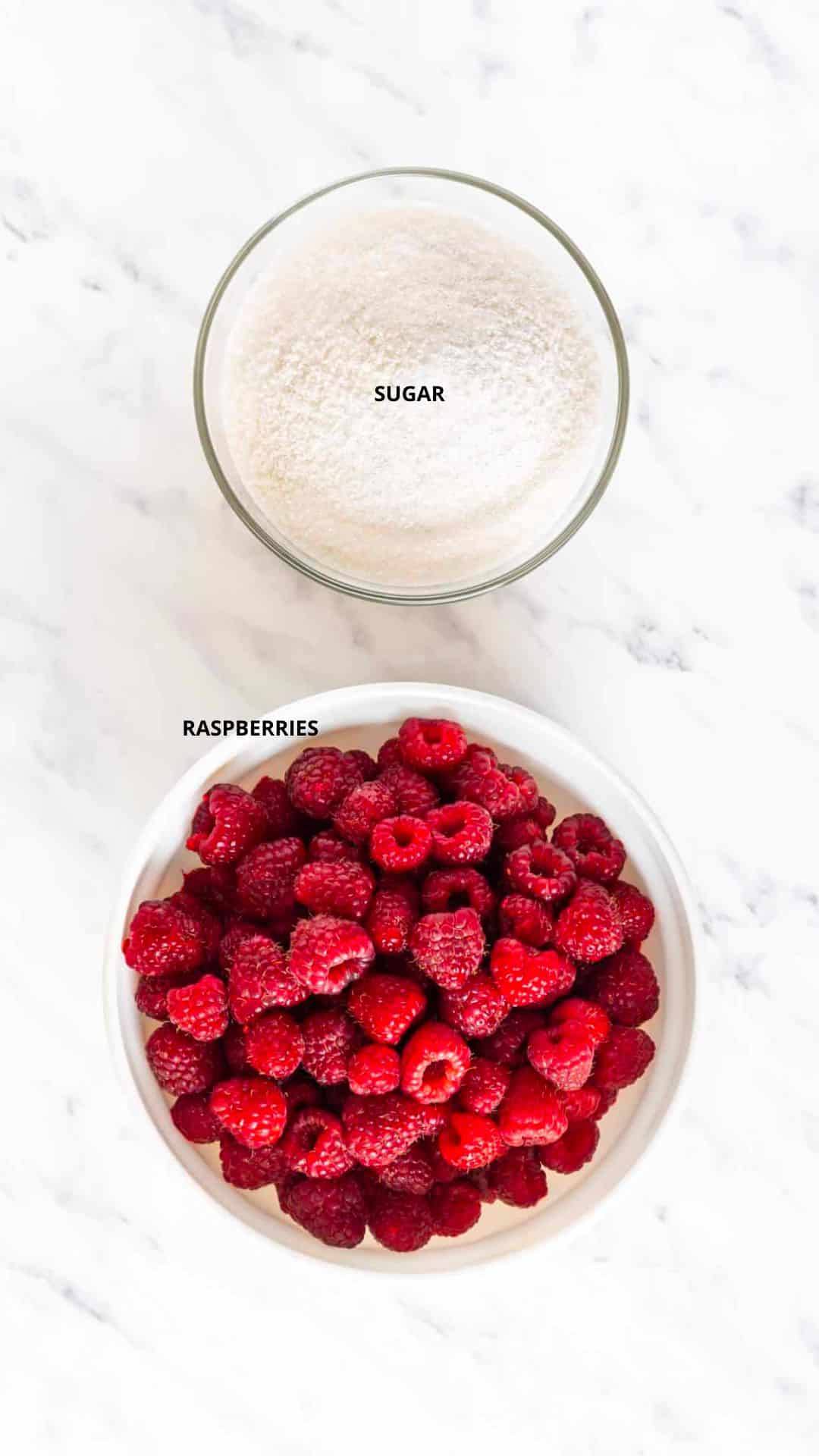 ingredients in bowls raspberries and sugar.