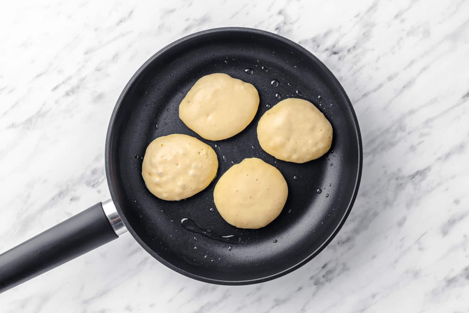 ukrainian pancakes cooking on a skillet