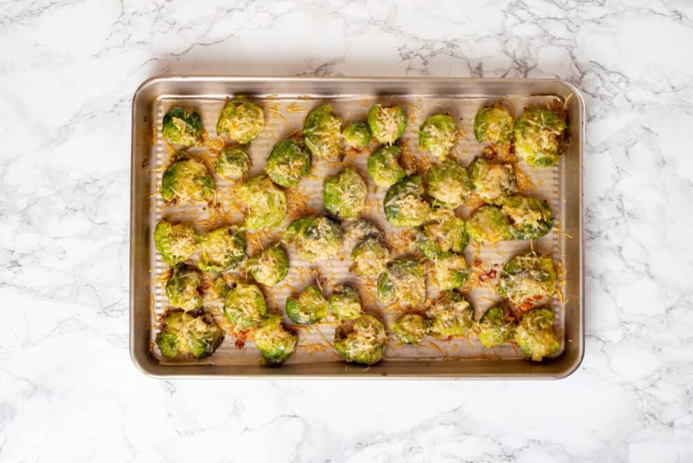 Roasted brussels sprouts on a baking tray.