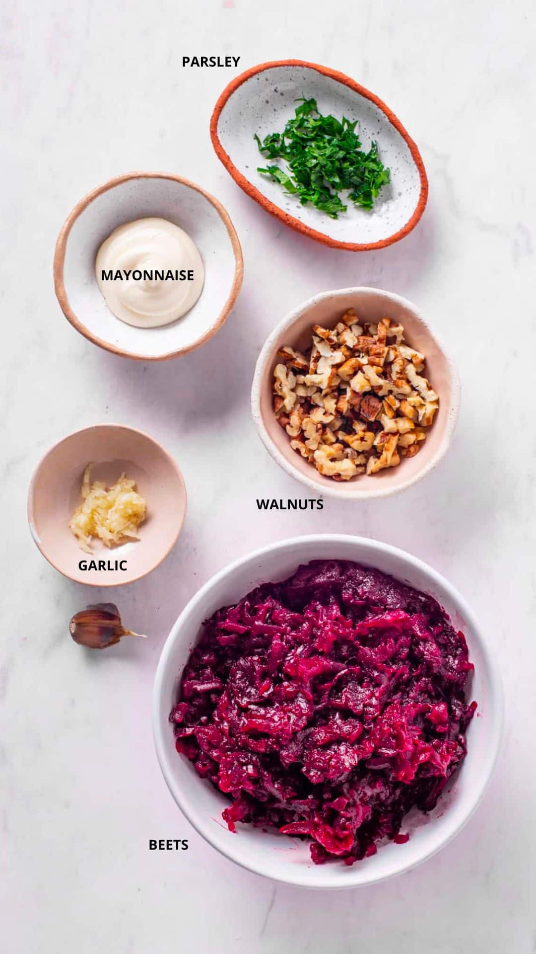 beet salad ingredients- parsley, mayonnaise, walnuts, garlic, and beets.