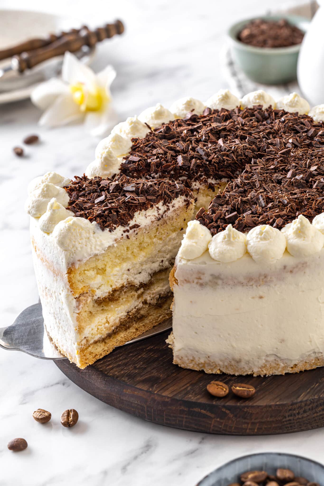 Sliced tiramisu cake showing inside layers.