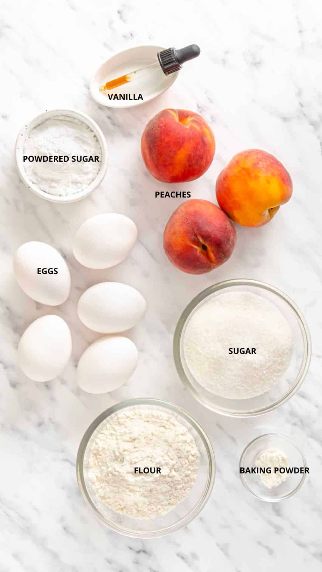 Upside down peach cake ingredients- vanilla, peaches, powdered sugar, eggs, sugar, baking powder, and flour.