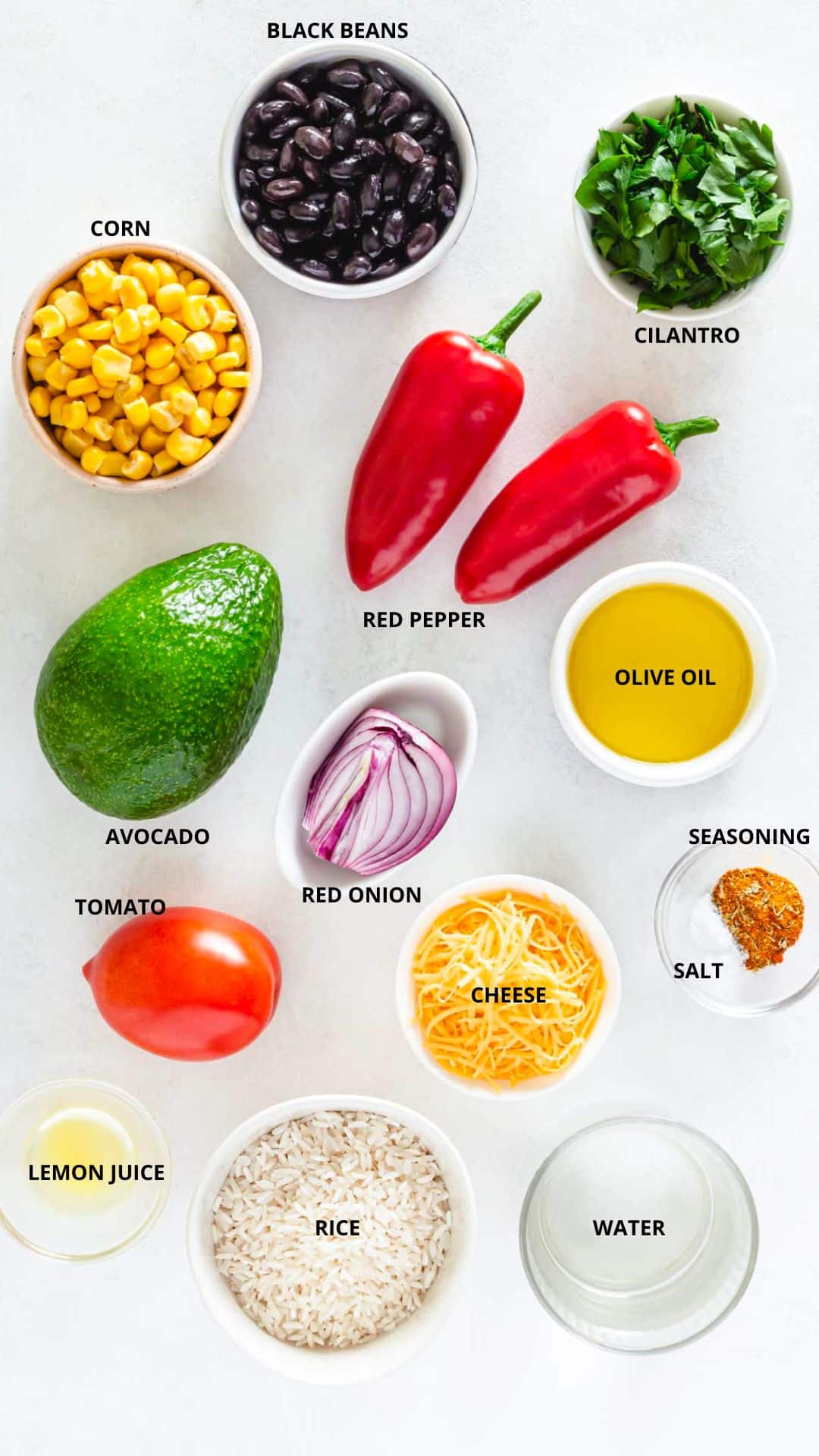 veggie bowl ingredients- black beans, cilantro, corn, red pepper, olive oil, red onion, tomato, avocado, cheese, salt, seasoning, lemon juice, rice, and water.