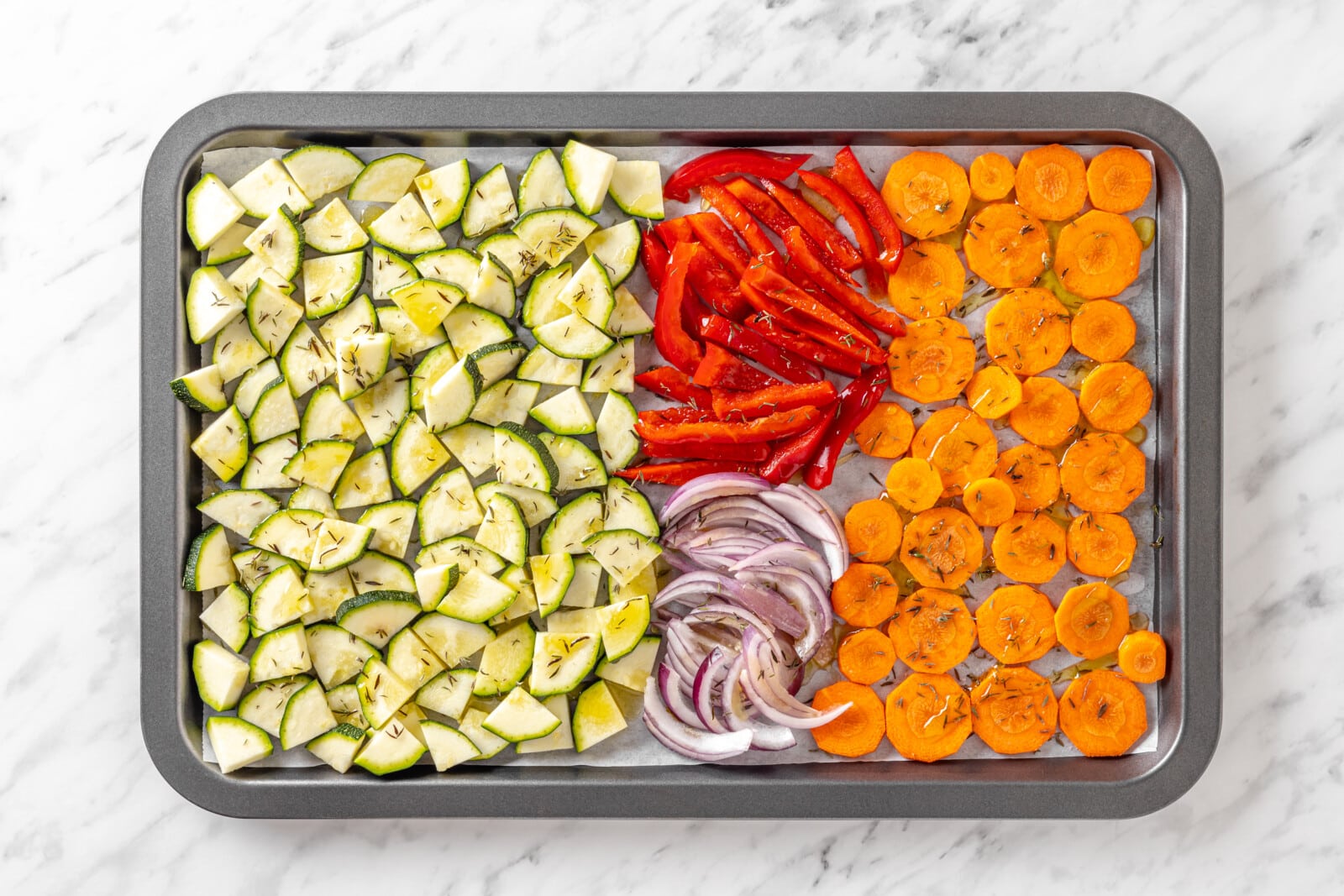 Veggies ready to roast on a tray.