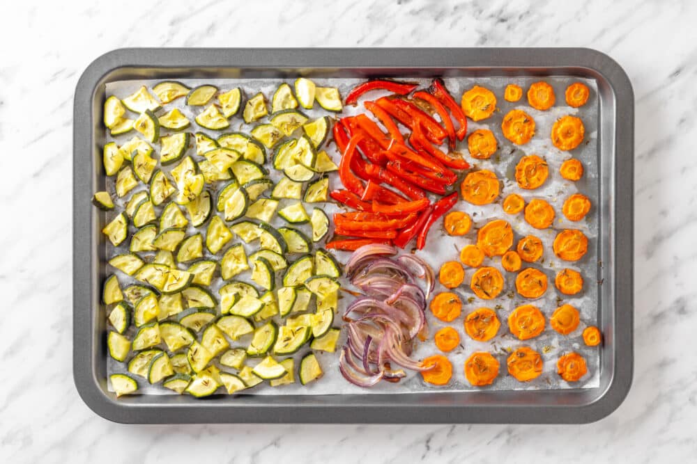 Veggies roasted on a baking tray.