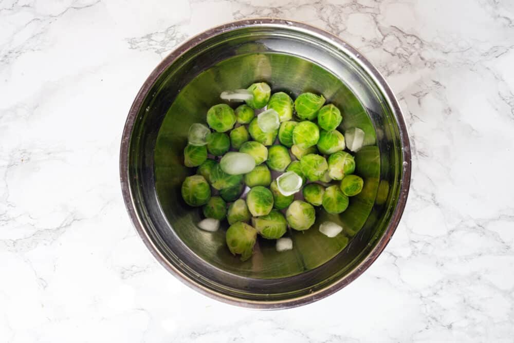 Washed brussels sprouts in a bowl.