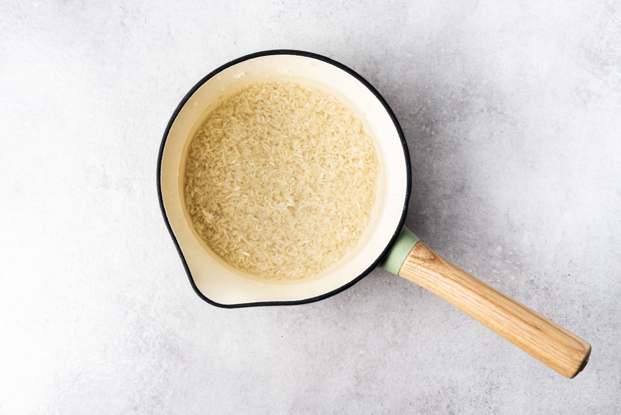 Rice and water in a pot.