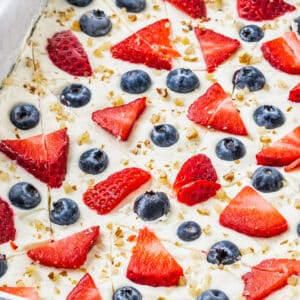 frozen yogurt bark in a pan cut up into random pieces.