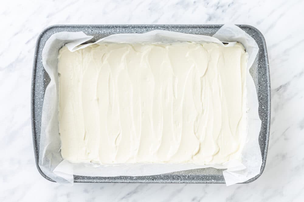 yogurt spread out with a spatula over parchment paper.